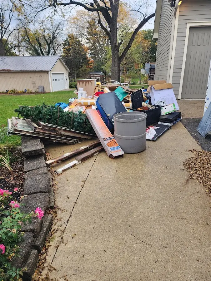 Dumpster being loaded with debris for 3 Yard Dumpster Rental in Wellington